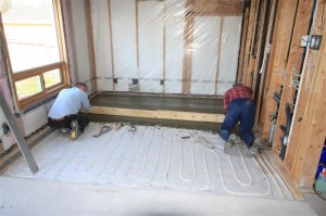 Concrete screeded over tubing