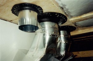 Ducts through a vapour bariier