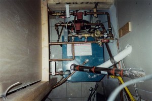natural gas boiler under a stairs landing